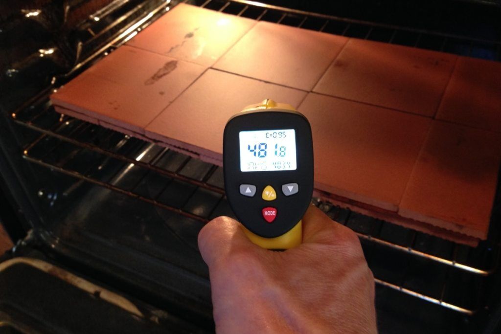 measuring oven pizza stone or tile temperature with eT650D infrared thermometer in the kitchen for that perfect pizza